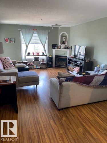 #404 78 A Mckenney Av Nw, St. Albert, AB - Indoor Photo Showing Living Room With Fireplace