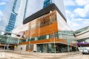 The property is a modern high-rise building with a glass and wood-toned facade - 2506 10360 102 Street, Edmonton, AB  - Outdoor 