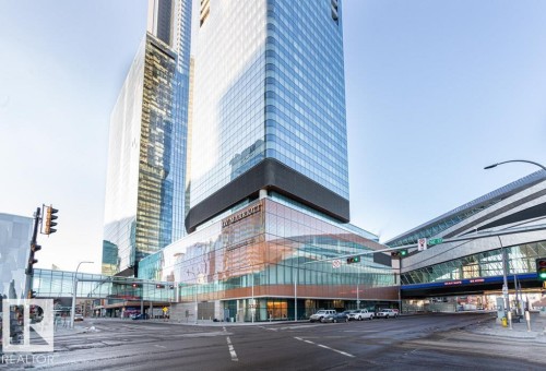 This property is located in a vibrant urban setting, featuring a distinctive glass facade - 2506 10360 102 Street, Edmonton, AB - Outdoor