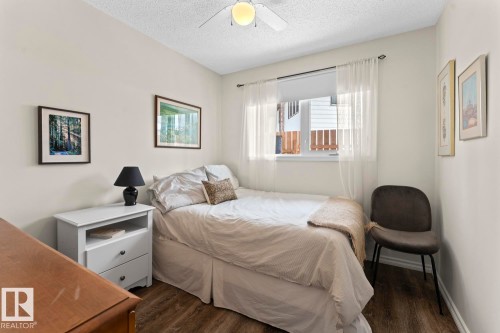 This room features light-colored walls, wood-style flooring, and a ceiling fan - 4003 50A Avenue, Cold Lake, AB - Indoor Photo Showing Bedroom