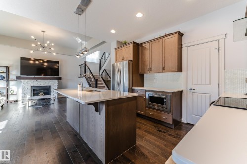 15907 18 Avenue, Edmonton, AB - Indoor Photo Showing Kitchen With Fireplace
