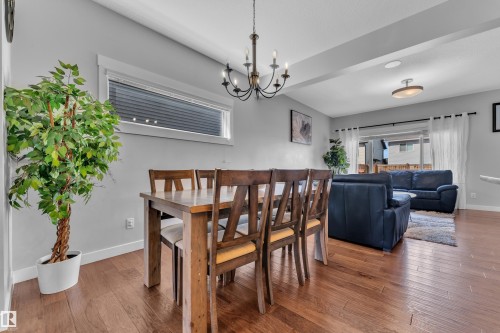 This property features hardwood floors throughout, with an open concept design - 6406 169 Avenue, Edmonton, AB - Indoor Photo Showing Dining Room