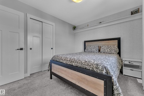 This room features light grey walls and light grey carpeting, creating a neutral palette - 6406 169 Avenue, Edmonton, AB - Indoor Photo Showing Bedroom