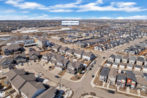 Aerial view of the neighborhood showcasing numerous residential properties, streets, and an open undeveloped area in the background - 6406 169 Avenue, Edmonton, AB - Outdoor With View