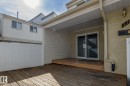 The property features an outdoor wooden deck with a covered patio area, perfect for outdoor enjoyment - 37 Woodvale Village, Edmonton, AB  - Outdoor With Deck Patio Veranda With Exterior 