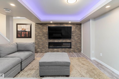 4026 Orchards Drive, Edmonton, AB - Indoor Photo Showing Living Room With Fireplace