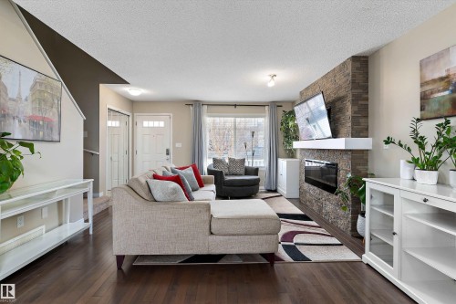 4026 Orchards Drive, Edmonton, AB - Indoor Photo Showing Living Room With Fireplace