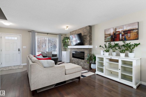 4026 Orchards Drive, Edmonton, AB - Indoor Photo Showing Living Room With Fireplace