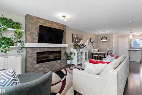 4026 Orchards Drive, Edmonton, AB - Indoor Photo Showing Living Room With Fireplace