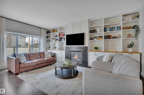 8945 24 Avenue, Edmonton, AB - Indoor Photo Showing Living Room With Fireplace