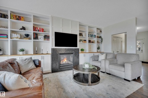 8945 24 Avenue, Edmonton, AB - Indoor Photo Showing Living Room With Fireplace
