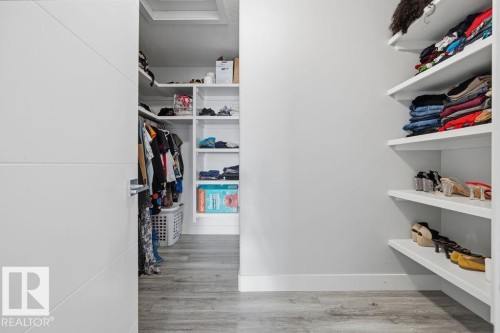 The property features a closet with built-in shelving and hanging space, providing extensive storage options - 17534 60A Street, Edmonton, AB - Indoor With Storage