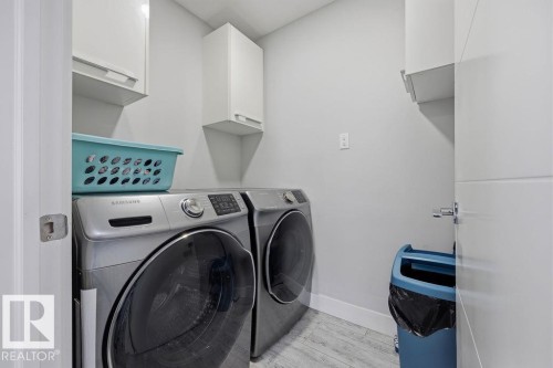 The property features a dedicated laundry area with light gray walls and white trim - 17534 60A Street, Edmonton, AB - Indoor Photo Showing Laundry Room