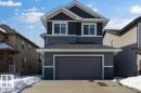 The property features a two-story exterior with multi-toned siding, a two-car garage, and a concrete driveway - 17534 60A Street, Edmonton, AB  - Outdoor 