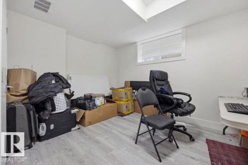 This room features light-colored walls and flooring, with a window providing natural light - 17534 60A Street, Edmonton, AB - Indoor