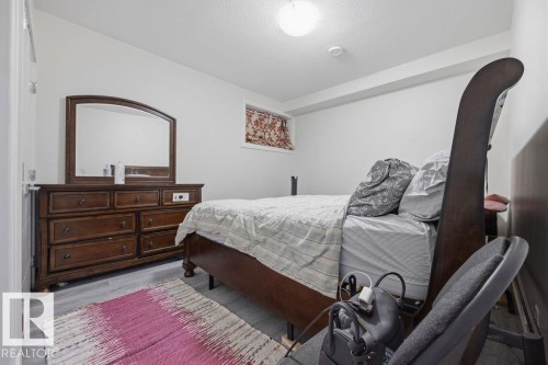 The property features light-colored flooring, white walls, and a window - 17534 60A Street, Edmonton, AB - Indoor Photo Showing Bedroom