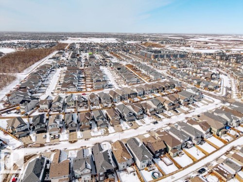 Aerial view of the surrounding residential neighborhood featuring a variety of housing styles and a clear sky - 17534 60A Street, Edmonton, AB - Outdoor With View