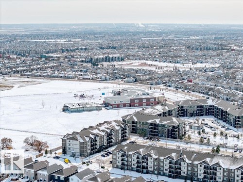 An aerial view showcasing the surrounding community with residential properties and open spaces - 17534 60A Street, Edmonton, AB - Outdoor With View
