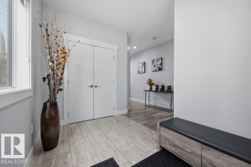 The property features light-colored tile flooring, white trim, and light gray walls - 17534 60A Street, Edmonton, AB - Indoor Photo Showing Other Room