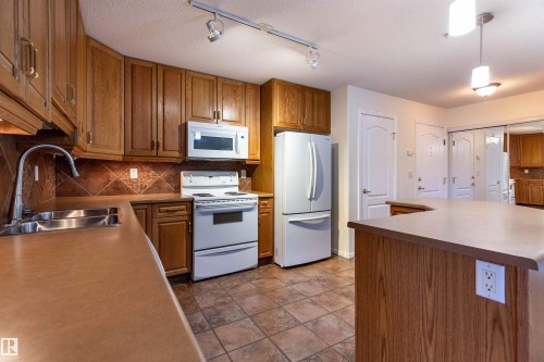 105 8912 156 Street, Edmonton, AB - Indoor Photo Showing Kitchen With Double Sink