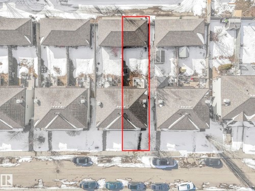 Aerial view of the property, featuring a gray shingle roof and a yard with visible ground cover - 675 Mcallister Loop, Edmonton, AB - 