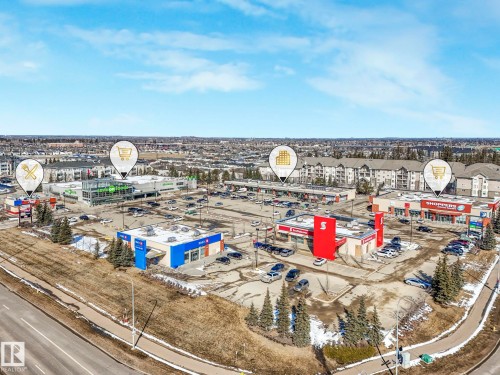 Aerial view showcasing the surrounding commercial amenities, including various retail stores and dining options - 675 Mcallister Loop, Edmonton, AB - Outdoor With View