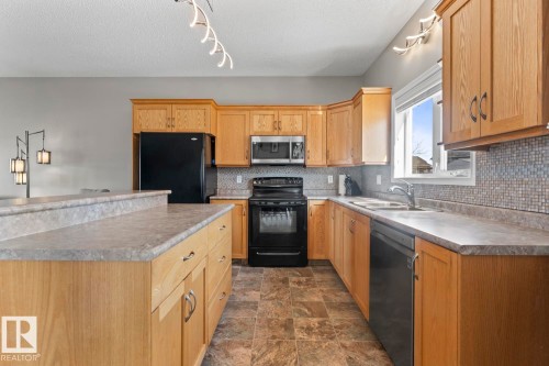 706 Robin Close, Cold Lake, AB - Indoor Photo Showing Kitchen With Double Sink