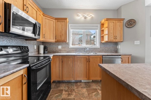 706 Robin Close, Cold Lake, AB - Indoor Photo Showing Kitchen With Double Sink