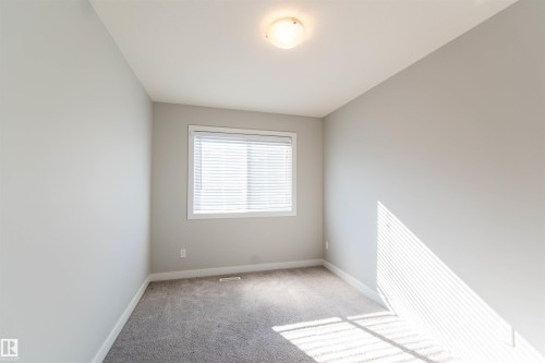 This room features a window with blinds, light gray walls, and carpet flooring - 1793 Keene Crescent, Edmonton, AB - Indoor Photo Showing Other Room