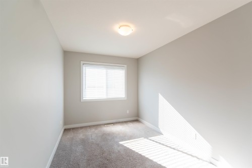 This room features light grey walls, a window with blinds, and carpeted flooring - 1793 Keene Crescent, Edmonton, AB - Indoor Photo Showing Other Room