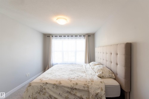 Bedroom with light grey walls, a single window, and a ceiling-mounted light fixture - 1793 Keene Crescent, Edmonton, AB - Indoor Photo Showing Bedroom