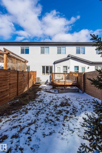The property features a private fenced yard with a wooden deck - 1793 Keene Crescent, Edmonton, AB - Outdoor With Deck Patio Veranda
