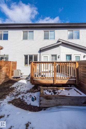 The property features a wooden deck and a wooden planter box - 1793 Keene Crescent, Edmonton, AB - Outdoor With Deck Patio Veranda With Exterior