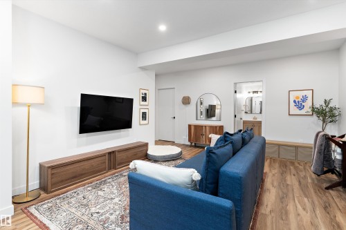 Living area featuring light wood flooring and white walls, with a recessed ceiling light - 1305 Enright Landing, Edmonton, AB - Indoor Photo Showing Living Room
