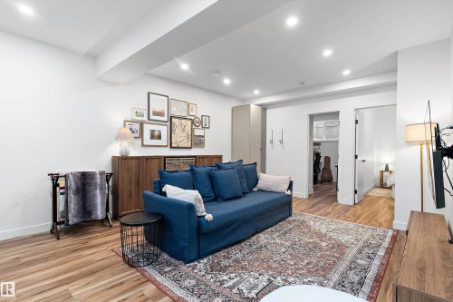 Living area featuring recessed lighting, light-toned flooring, and a large area rug - 1305 Enright Landing, Edmonton, AB - Indoor Photo Showing Living Room