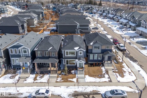 The property features a dark-colored roof and a multi-level exterior - 1305 Enright Landing, Edmonton, AB - Outdoor With Facade