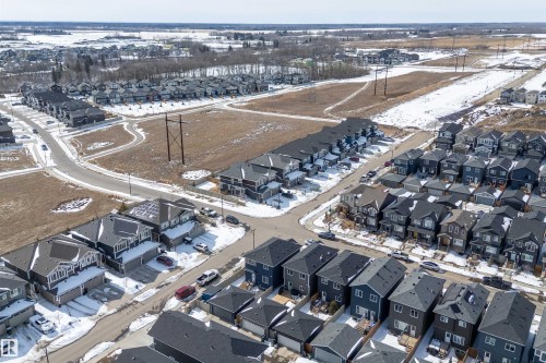 Aerial view showcasing the residential community with detached and attached homes - 1305 Enright Landing, Edmonton, AB - Outdoor With View