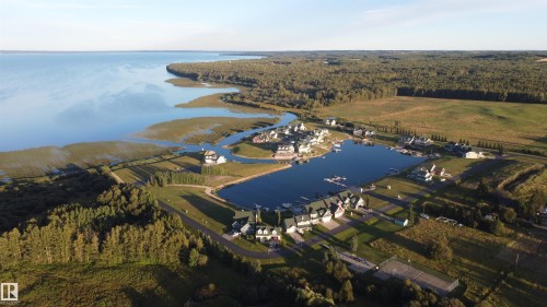 Aerial view of the property and its surrounding area - 17 Sunset Harbour, Rural Wetaskiwin County, AB - Outdoor With Body Of Water With View