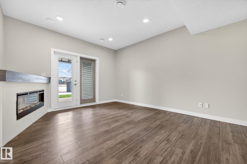 433 Meadowview Drive, Fort Saskatchewan, AB - Indoor Photo Showing Other Room With Fireplace