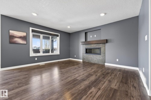 433 Meadowview Drive, Fort Saskatchewan, AB - Indoor Photo Showing Living Room With Fireplace