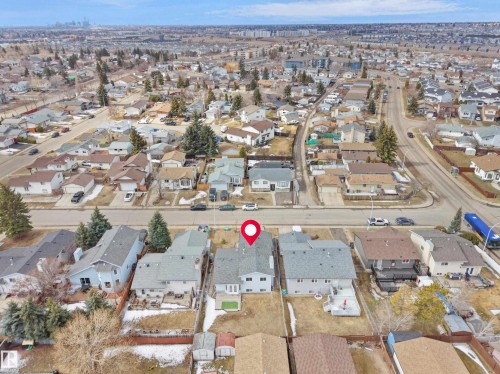 Aerial view of the property and its surrounding neighbourhood, featuring detached homes, paved roads, and mature trees - 14523 32 Street, Edmonton, AB - Outdoor With View