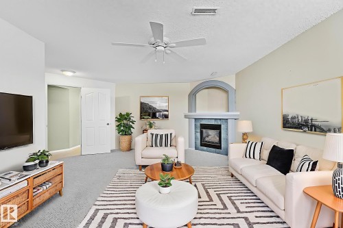 2 Creekside Way, Spruce Grove, AB - Indoor Photo Showing Living Room With Fireplace