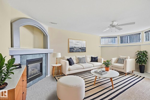 2 Creekside Way, Spruce Grove, AB - Indoor Photo Showing Living Room With Fireplace