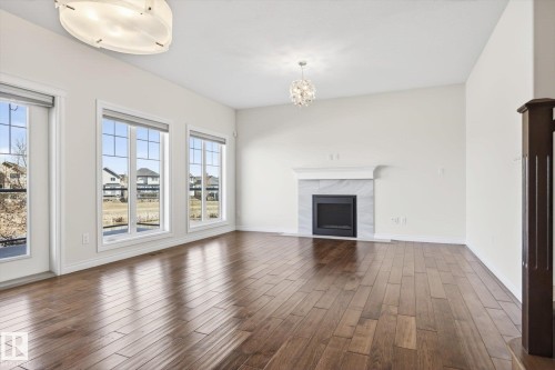 15856 13 Avenue, Edmonton, AB - Indoor Photo Showing Living Room With Fireplace