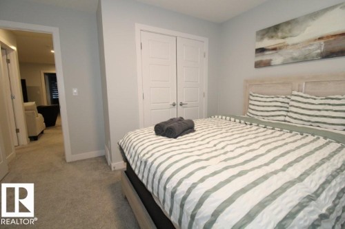 This room features light grey walls and carpet flooring - 22140 81 Avenue, Edmonton, AB 