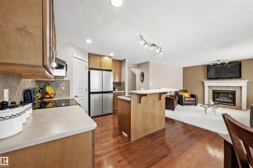 304 79 Street, Edmonton, AB - Indoor Photo Showing Kitchen With Fireplace