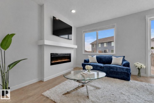 3861 Chrustawka Place, Edmonton, AB - Indoor Photo Showing Living Room With Fireplace