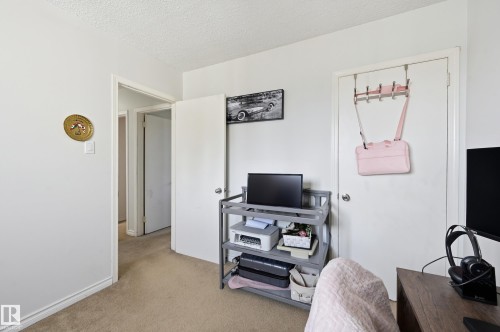 The room features light-colored walls and carpeted flooring - 9031 133 Avenue, Edmonton, AB - Indoor
