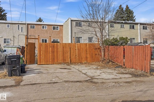 The property features a private fenced area with a wooden fence - 9031 133 Avenue, Edmonton, AB - Outdoor