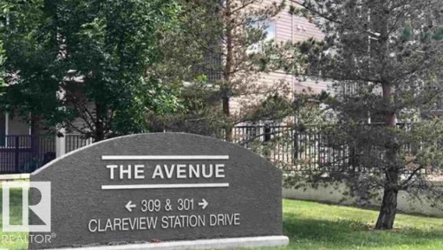 The property features a prominent sign with the name "THE AVENUE" and directional information for 309 & 301 Clareview Station Drive - 408 309 Clareview Station Drive Nw, Edmonton, AB - Outdoor